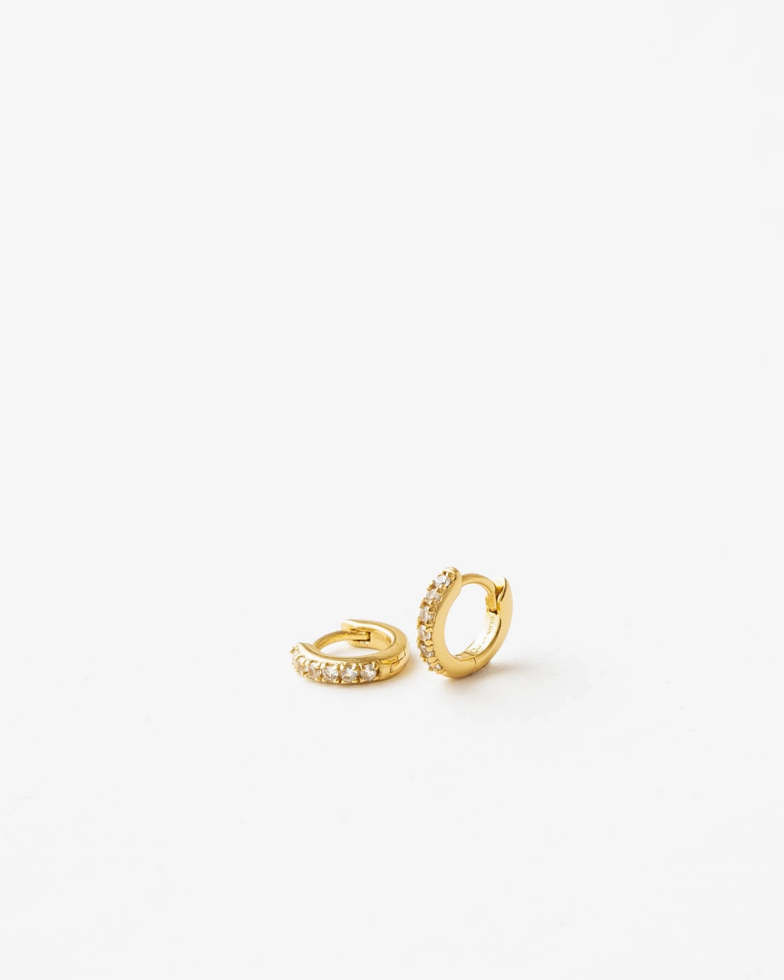 Ona White Sapphire Huggie Hoops