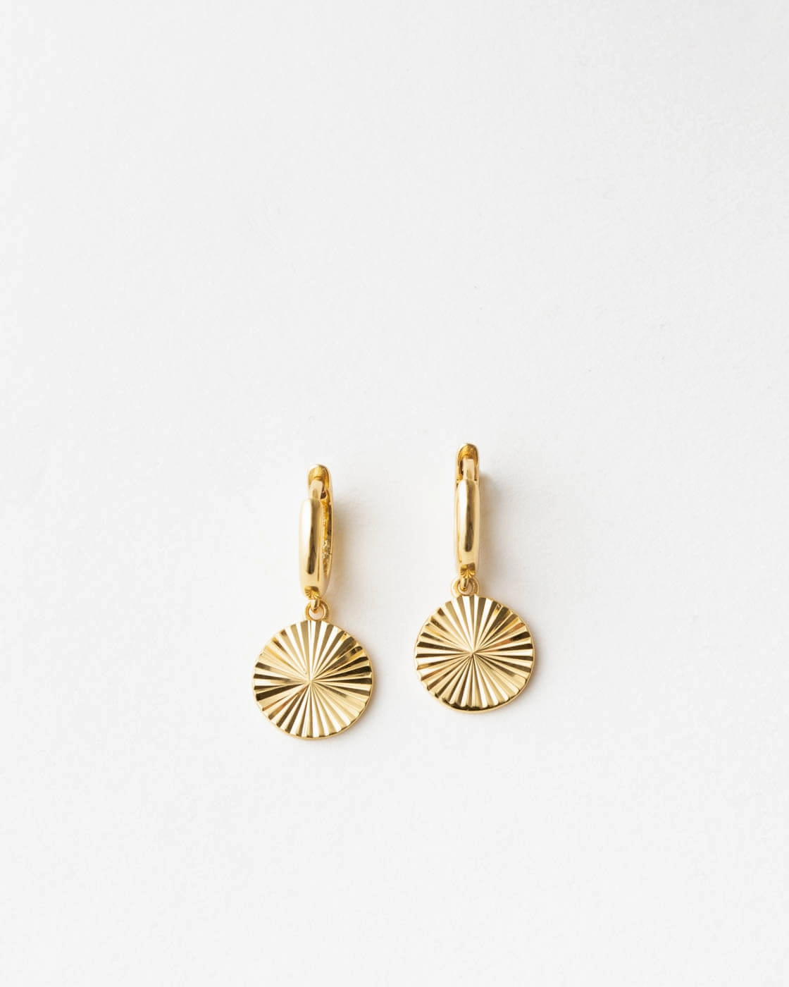 Radiant Charm Huggie Hoops