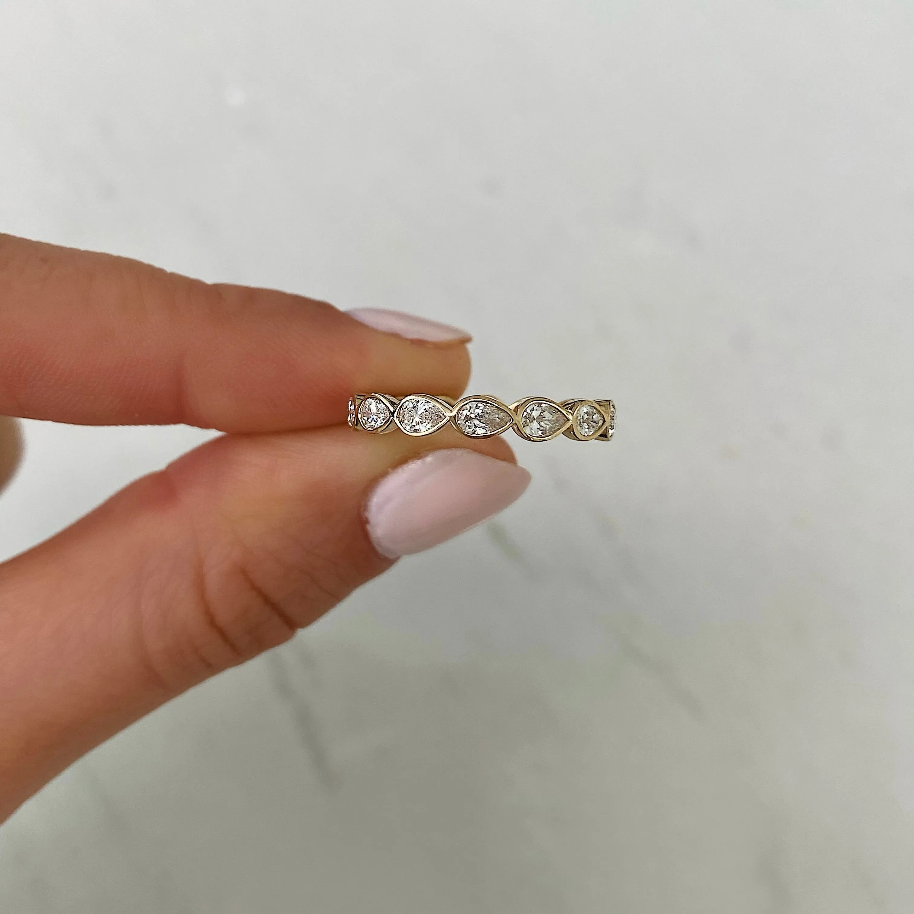 Sideways Pear Bezel Eternity Band